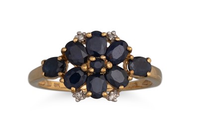Lot 166 - A SAPPHIRE AND DIAMOND CLUSTER RING, set with...
