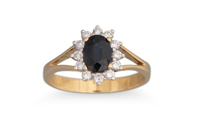 Lot 203 - A SAPPHIRE AND DIAMOND CLUSTER RING, the oval...