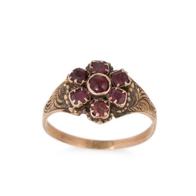 Lot 90 - A GARNET DAISY CLUSTER RING, mounted in yellow...