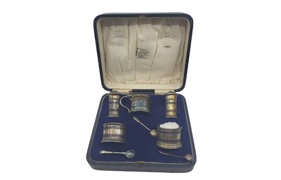 Lot 377 - A 1925 SILVER BIRMINGHAM FIVE PIECE CONDIMENT...
