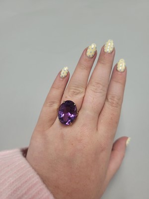 Lot 48 - AN AMETHYST DRESS RING, mounted in 9ct yellow...