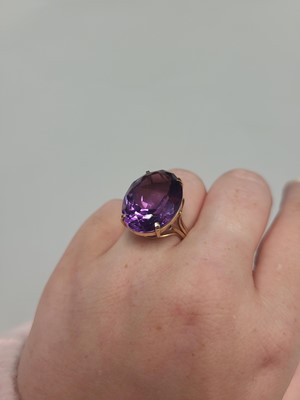 Lot 48 - AN AMETHYST DRESS RING, mounted in 9ct yellow...