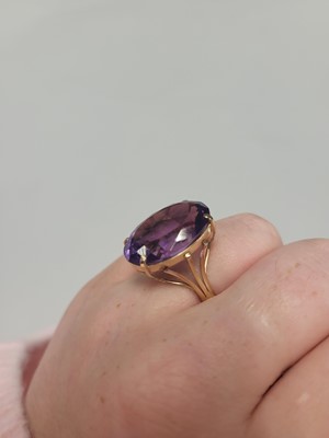 Lot 48 - AN AMETHYST DRESS RING, mounted in 9ct yellow...