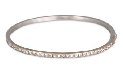 Lot 298 - A DIAMOND BANGLE, of hinged form set with...