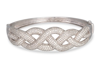 Lot 299 - A DIAMOND BANGLE, of hinged form with pavé set...