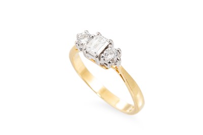Lot 2 - A THREE STONE DIAMOND RING, set with an...