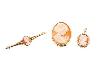Lot 140 - THREE VARIOUS CHARMS, mounted in 9ct gold, 12 g.