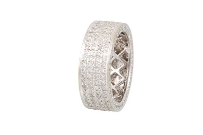 Lot 32 - A FOUR ROWED DIAMOND RING, pavé set in 18ct...