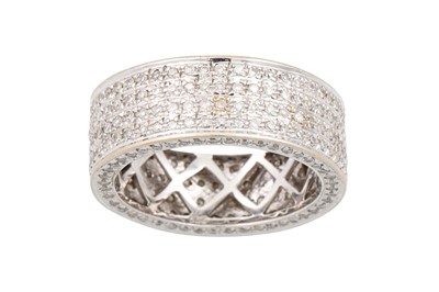 Lot 32 - A FOUR ROWED DIAMOND RING, pavé set in 18ct...