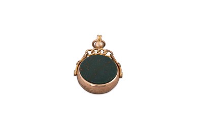 Lot 13 - AN ANTIQUE 9CT GOLD SWIVEL SEAL, set with...