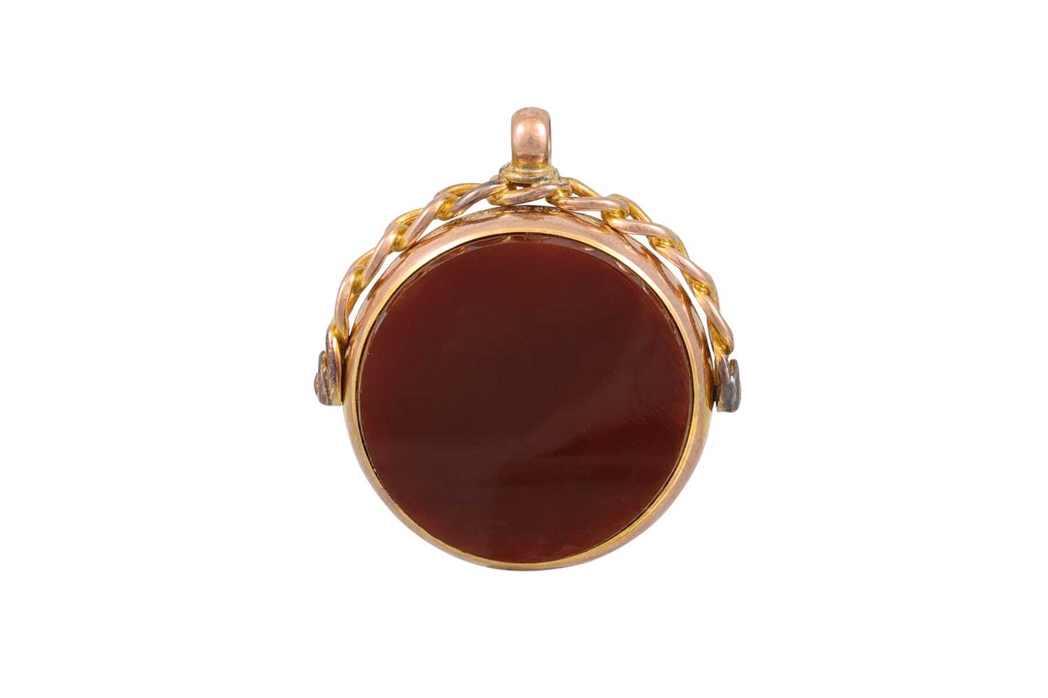 Lot 37 - AN ANTIQUE GOLD SWIVEL FOB, set with carnelian...