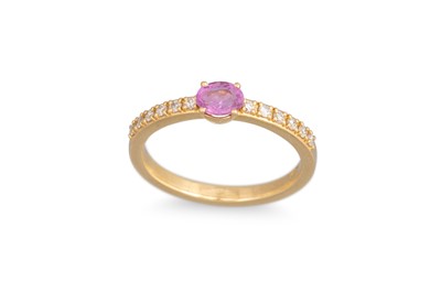 Lot 99 - A PINK SAPPHIRE AND DIAMOND SET BAND RING, the...