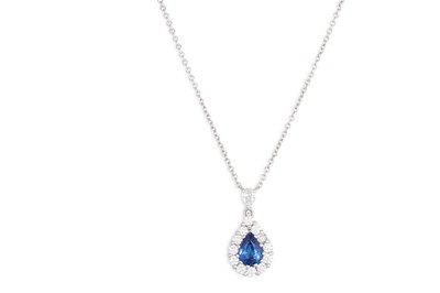 Lot 278 - A DIAMOND AND SAPPHIRE CLUSTER PENDANT, the...