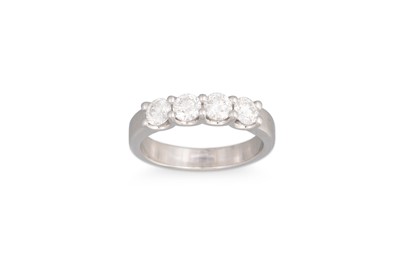 Lot 280 - A DIAMOND FOUR STONE RING, the brilliant cut...