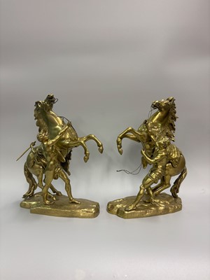 Lot 424 - A MEDIUM PAIR OF BRASS MARLY HORSES