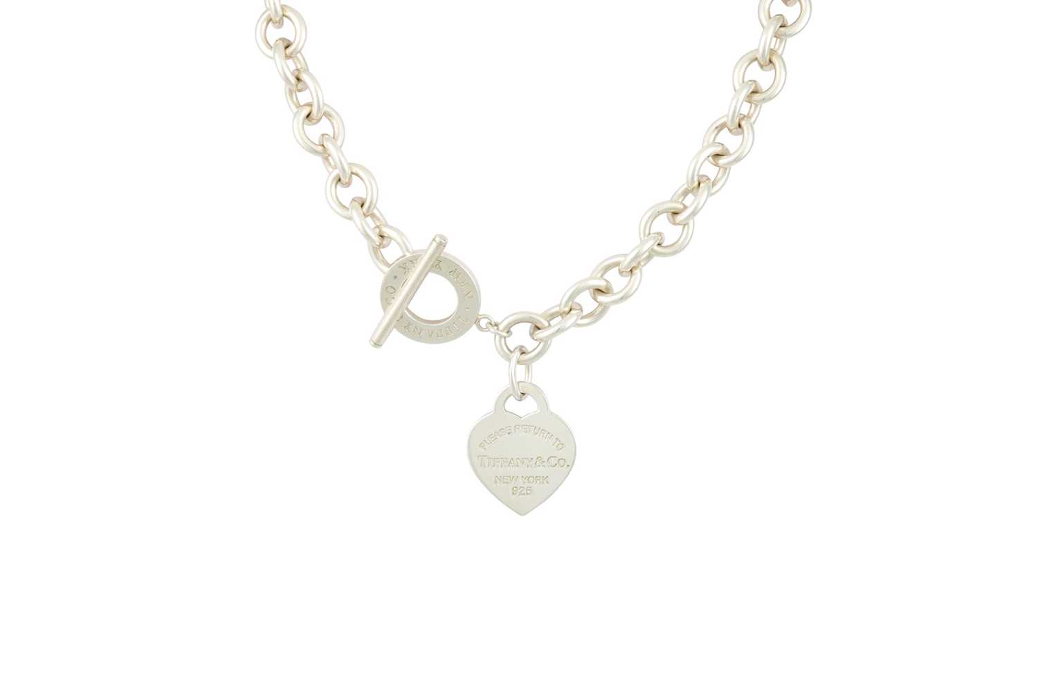 Lot 45 - A SILVER TIFFANY NECKLACE, suspending a love...
