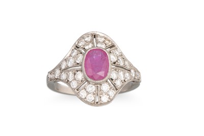 Lot 215 - A RUBY AND DIAMOND PLAQUE RING, the oval ruby...