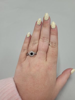 Lot 185 - A SAPPHIRE AND DIAMOND CLUSTER RING, of...