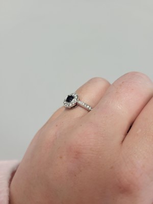 Lot 185 - A SAPPHIRE AND DIAMOND CLUSTER RING, of...