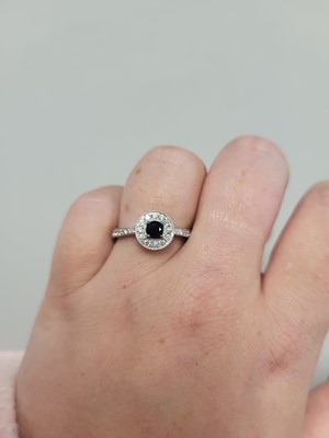 Lot 185 - A SAPPHIRE AND DIAMOND CLUSTER RING, of...