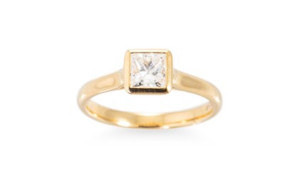 Lot 196 - A DIAMOND SOLITAIRE RING, the bezel cut...
