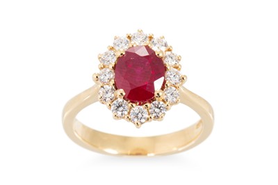 Lot 227 - A RUBY AND DIAMOND CLUSTER RING, the oval ruby...