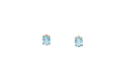 Lot 163 - A PAIR OF BLUE TOPAZ STUD EARRINGS, mounted in...