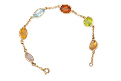 Lot 216 - A MULTI-GEM SET BRACELET, set with peridot,...