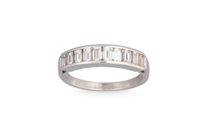 Lot 195 - A DIAMOND HALF ETERNITY RING, the baguette cut...