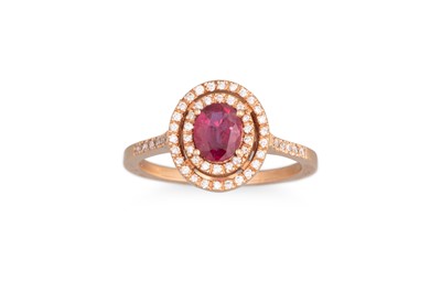 Lot 239 - A RUBY AND DIAMOND CLUSTER RING, the oval ruby...