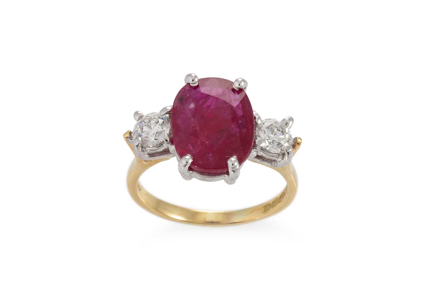 Lot 111 - A RUBY AND DIAMOND THREE STONE RING, the oval...