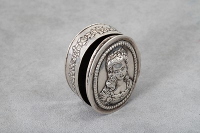 Lot 212 - AN OVAL WHITE METAL BOX, chaised and engraved...