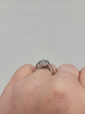 Lot 164 - A DIAMOND CLUSTER RING, the centre cushion cut...