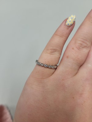 Lot 165 - A DIAMOND SET BAND RING, mounted in 18ct white...