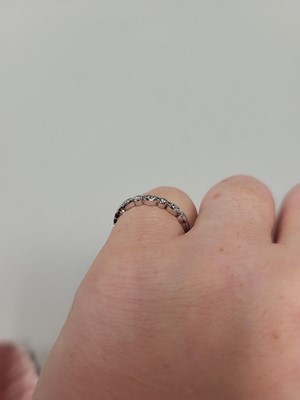 Lot 165 - A DIAMOND SET BAND RING, mounted in 18ct white...