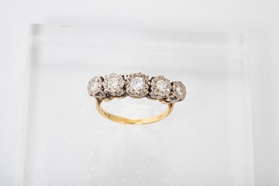 Lot 191 - A FIVE STONE DIAMOND RING, the round brilliant...
