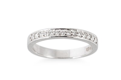 Lot 190 - A HALF ETERNITY RING, the channel set round...