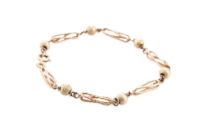 Lot 220 - A 9CT YELLOW GOLD FANCY LINK BRACELET, ca 7"...