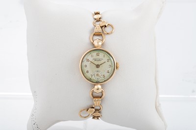 Lot 353 - A LADY'S 9CT GOLD WRISTWATCH, the dial signed "...