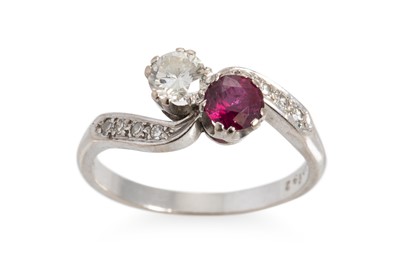 Lot 245 - A RUBY AND DIAMOND TWO STONE CROSS-OVER RING,...