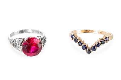 Lot 266 - TWO 9CT GOLD DRESS RINGS, 7.4 g.
