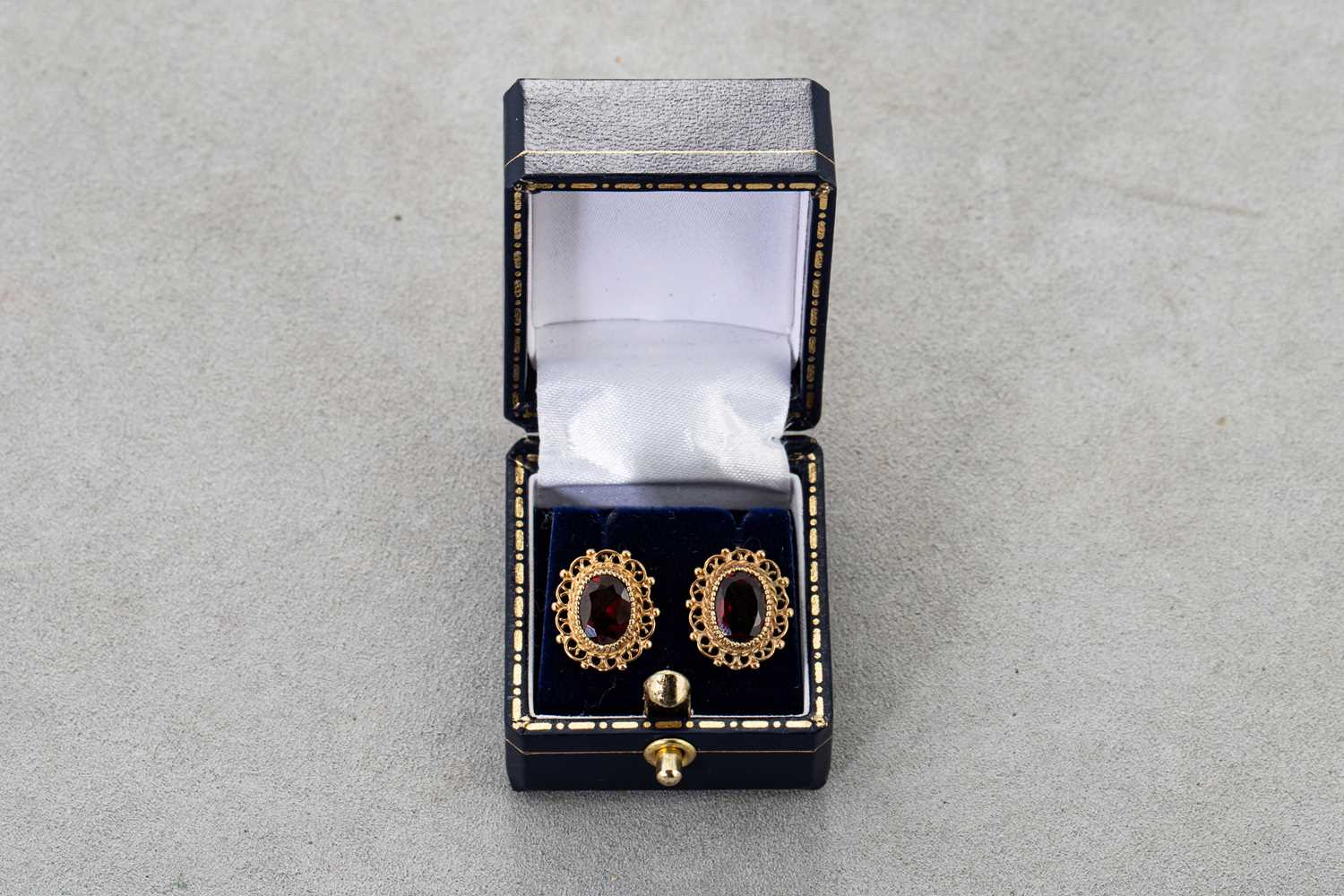 Lot 19 - A PAIR OF GARNET SET STUD EARRINGS, the collet...