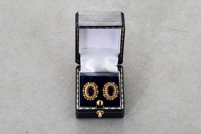 Lot 19 - A PAIR OF GARNET SET STUD EARRINGS, the collet...