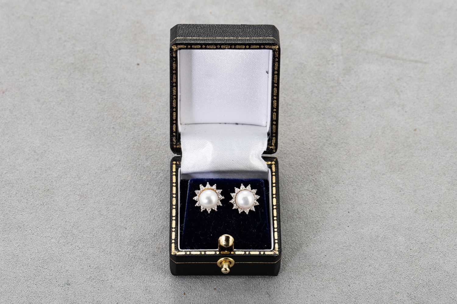 Lot 24 - A PAIR OF DIAMOND AND PEARL EARRINGS, the...