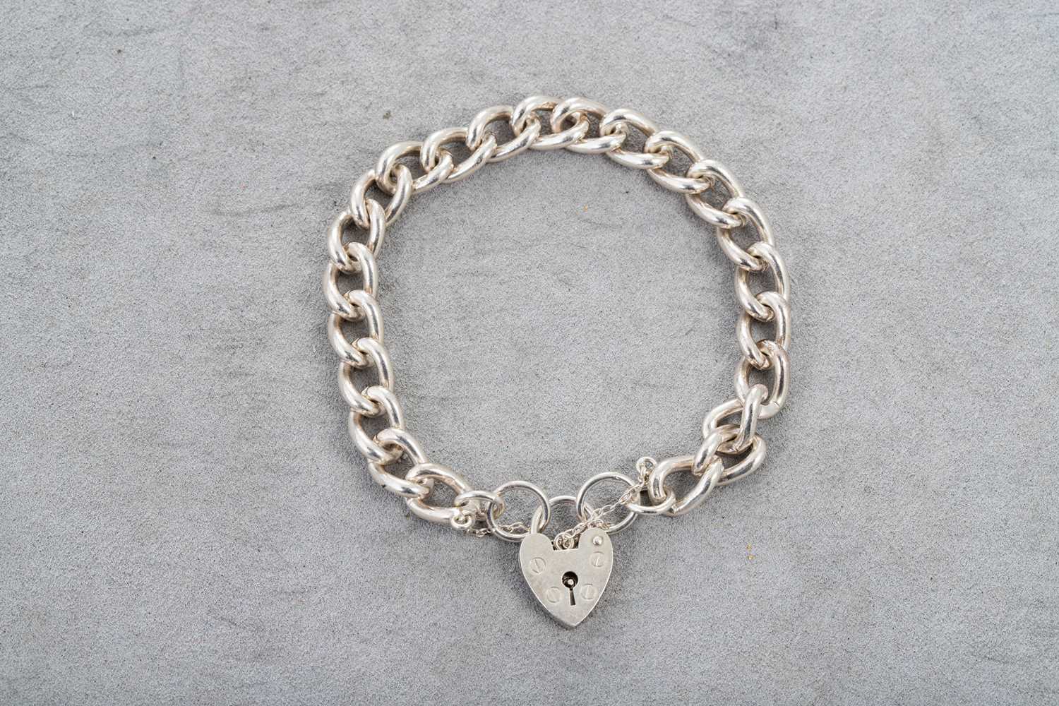 Lot 29 - A SILVER CURB LINK BRACELET, with padlock &...