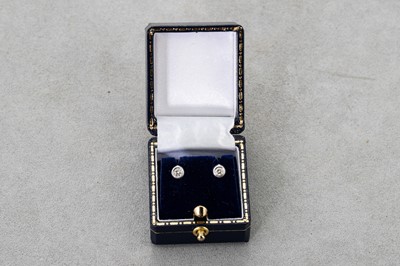 Lot 30 - A PAIR OF DIAMOND STUD EARRINGS, the round...