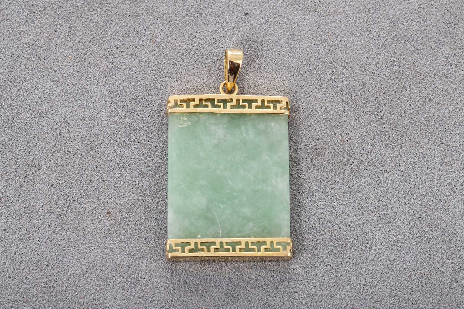 Lot 31 - A 14CT GOLD JADE PENDANT, the flat rectangular...