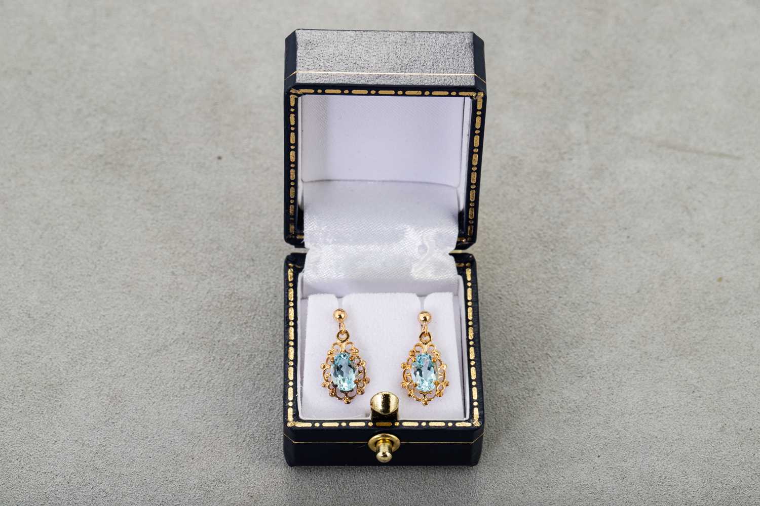 Lot 33 - A PAIR OF TOPAZ DROP EARRINGS, the oval...
