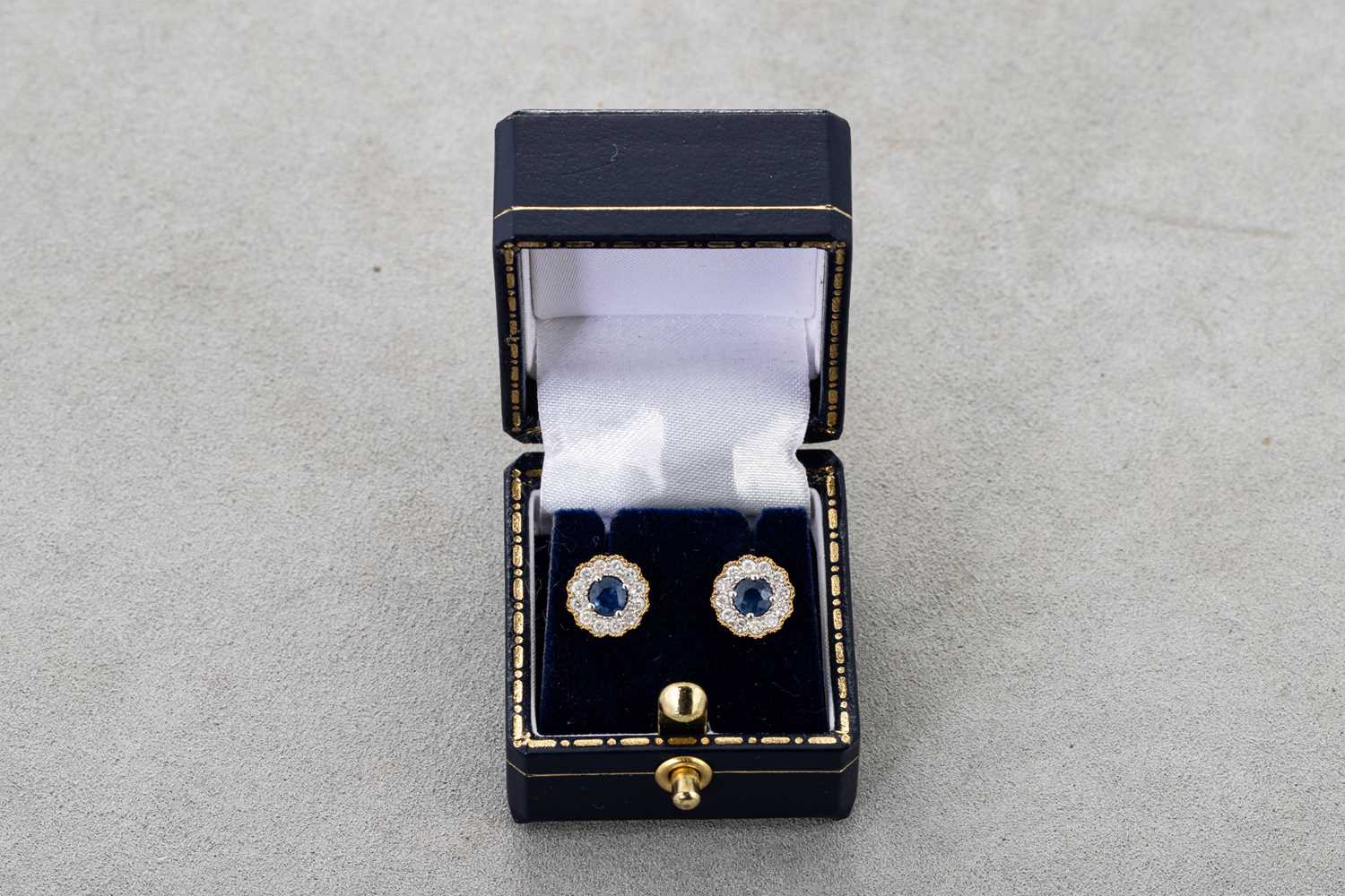 Lot 34 - A PAIR OF DIAMOND AND SAPPHIRE CLUSTER...