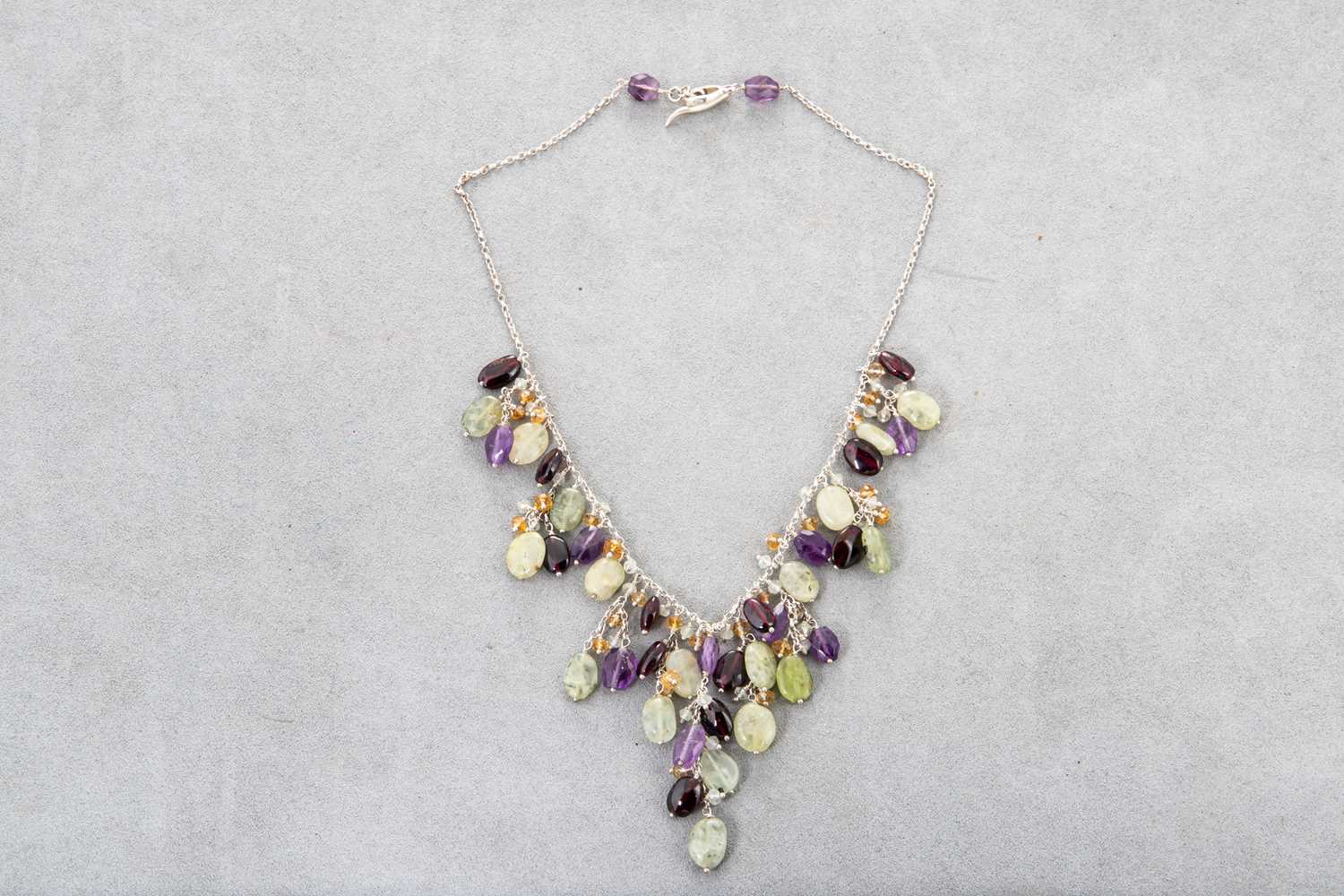 Lot 36 - A MULTI STONE SET NECKLACE, mounted in silver